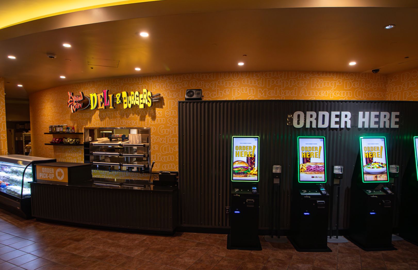 Grand River Deli & Burgers entrance with self-order kiosks and pickup counter
