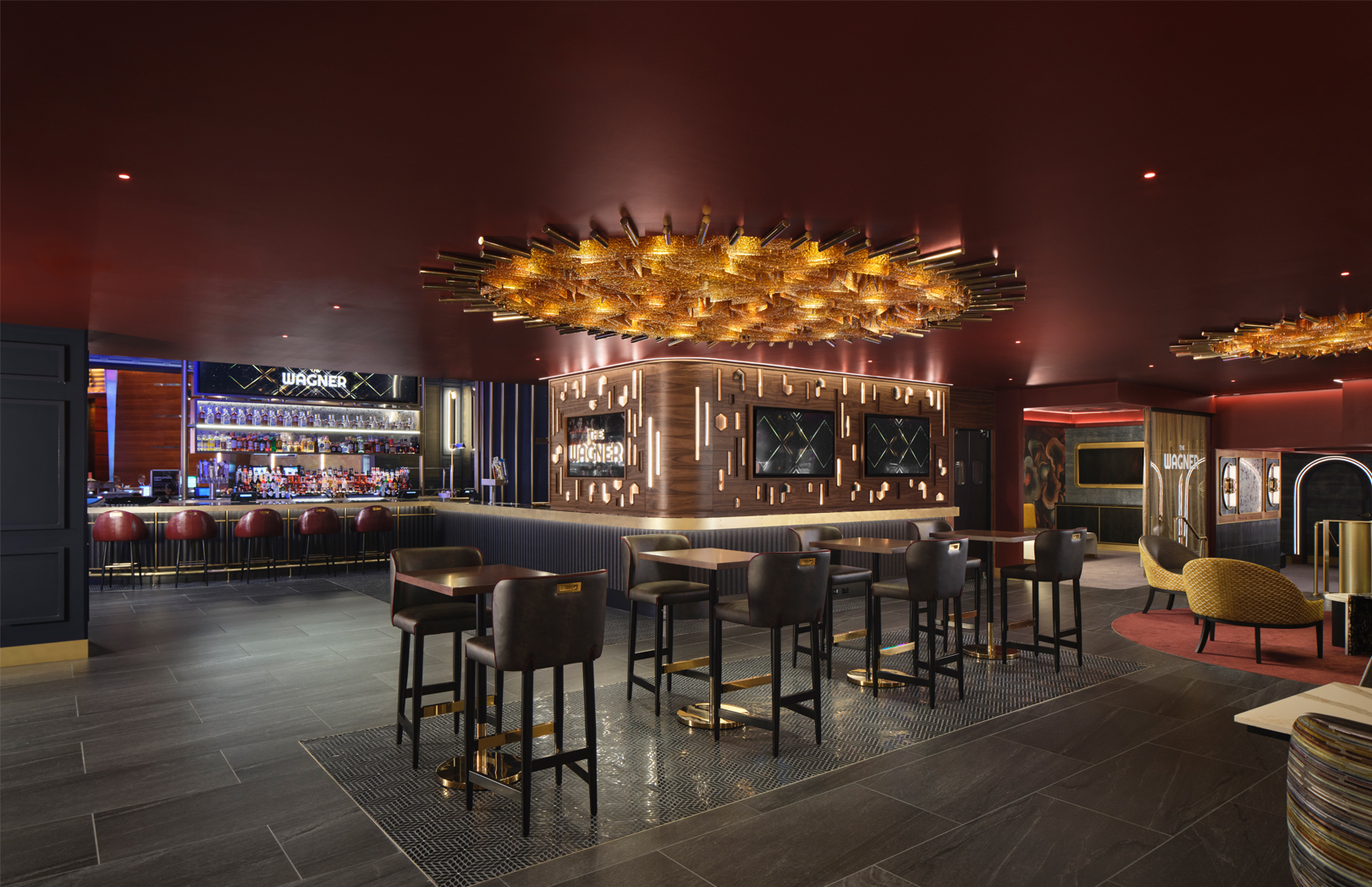 The Wagner sitting area at MotorCity Casino Hotel with bar seating and high-top tables